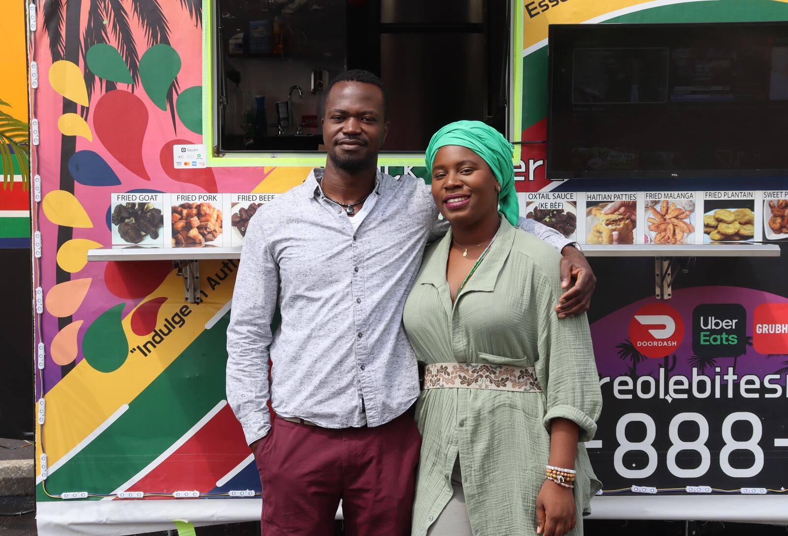 Michael Moiyallah and Marie Morett pose in front of the new Haitian food truck, Creole Bites, on Friday, Aug. 11, 2023. JESSICA OROZCO/STAFF