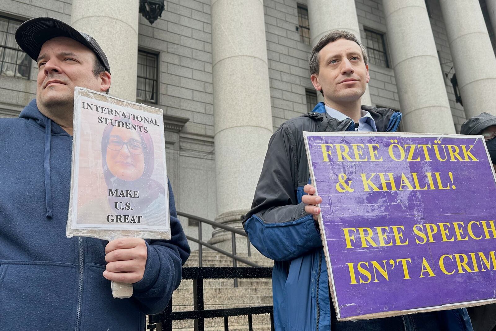 Protesters hold up signs outside court as a federal appeals court is scheduled to hear arguments in the cases of a Turkish Tufts University student who has been detained by immigration authorities for six weeks and a Palestinian student at Columbia University who was recently released from detention on Tuesday, May 6, 2025 in New York. (AP Photo/David Martin)