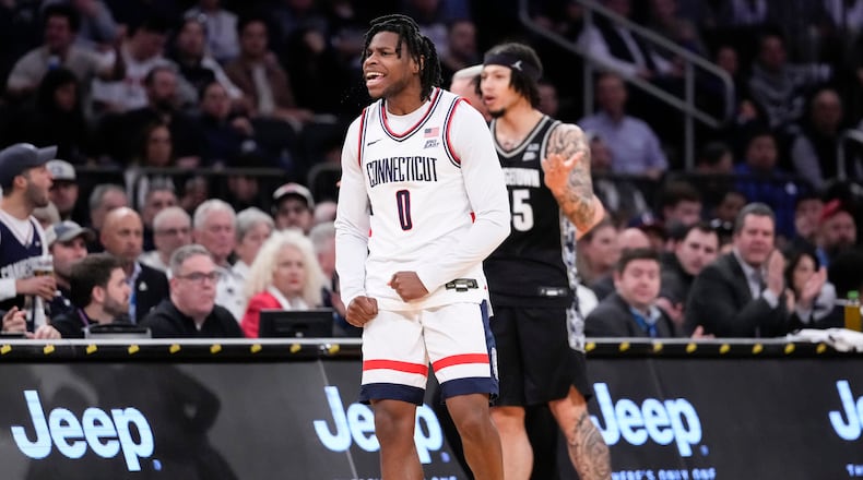 UConn guard Malachi Smith (0) reacts after stealing the ball during the first half of an NCAA college basketball game against Georgetown in the semifinals of the Big East tournament, Friday, March 13, 2026, in New York. (AP Photo/Yuki Iwamura)
