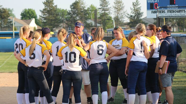 Springfield High School softball coach Brett Sadler (center) talks to the Wildcats’ players following a 9-3 loss in the Division I sectional finals to Centerville on Monday. Greg Billing / Contributed