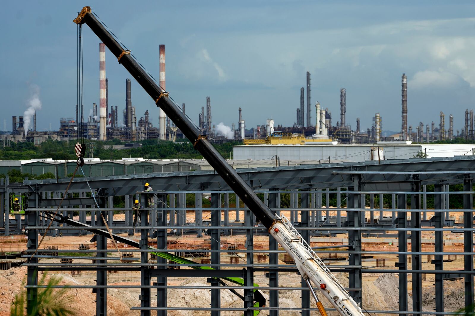 Employees work at a BYD vehicle factory being built in Camacari, Bahia state, Brazil, Thursday, March 6, 2025. (AP Photo/Eraldo Peres)