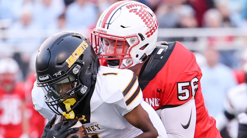 Tippecanoe junior defensive lineman Ryan Kolb tackles Sidney's Jamari Combs during a Miami Valley League game on Thursday, Sept. 25 at Tipp City Park. BRYANT BILLING / STAFF