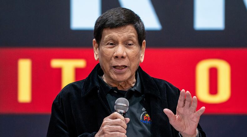 FILE - Former President of the Philippines Rodrigo Duterte speaks inside the Southorn Stadium during a thanksgiving gathering organized by Hong Kong-based Filipino workers for the former populist president in Hong Kong on March 9, 2025. (AP Photo/Vernon Yuen, File)