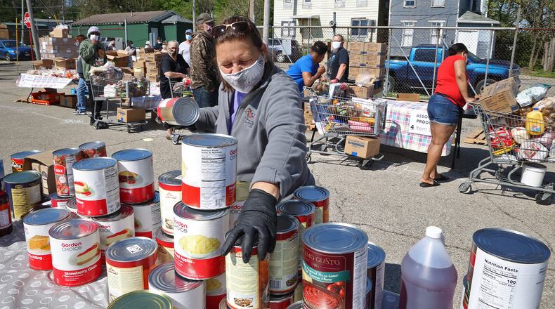 Annett Eanes is a volunteer at Second Harvest Food Bank in Springfield. The food bank is one of 66 organizations to receive funding from the United Way of Clark, Champaign and Madison Counties. BILL LACKEY/STAFF