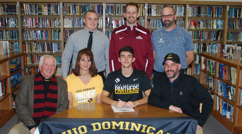 Present for Cooper Johnson’s signing at Urbana High School were, front (left): Than Johnson (grandfather), Amy Johnson (mother), Cooper Johnson and Lance Johnson (father). Back (left): former Hillclimbers head coach Jon Daniels, assistant coach Patrick Trenor and trainer Ed Wisner. CONTRIBUTED PHOTO