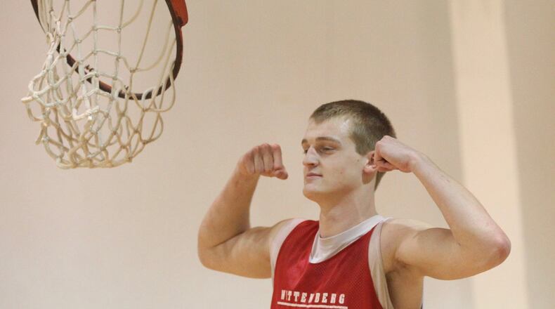 Wittenberg’s Chad Roy poses after breaking a rim at practice on Tuesday, Nov. 8, 2017, at Pam Evans Smith Arena in Springfield. David Jablonski/Staff