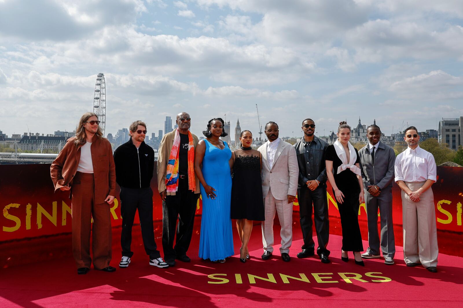 Composer Ludwig Goransson, from left, Jack O'Connell, Delroy Lindo, Wunmi Mosaku, producer Zinzi Coogler, director Ryan Coogler Michael B. Jordan, Hailee Steinfeld, Miles Caton and producer Sev Ohanian pose for photographers during the photo call for the film 'Sinners' on Sunday, April 13, 2025, in London. (Photo by Millie Turner/Invision/AP)