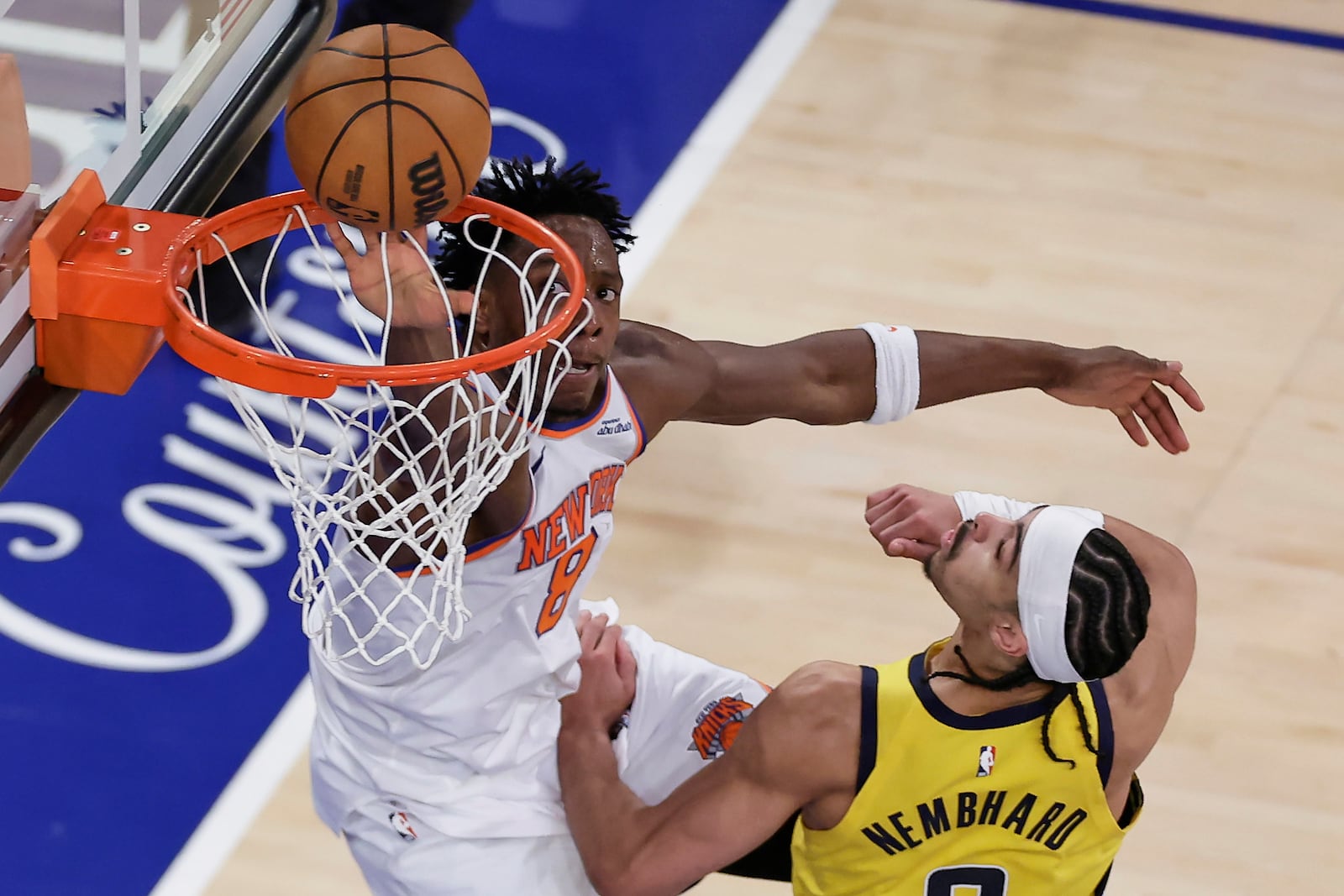 New York Knicks forward OG Anunoby (8) lays up a shot against Indiana Pacers guard Andrew Nembhard (2) during the third quarter of Game 5 of the NBA basketball Eastern Conference final, Thursday, May 29, 2025, in New York. (AP Photo/Adam Hunger)