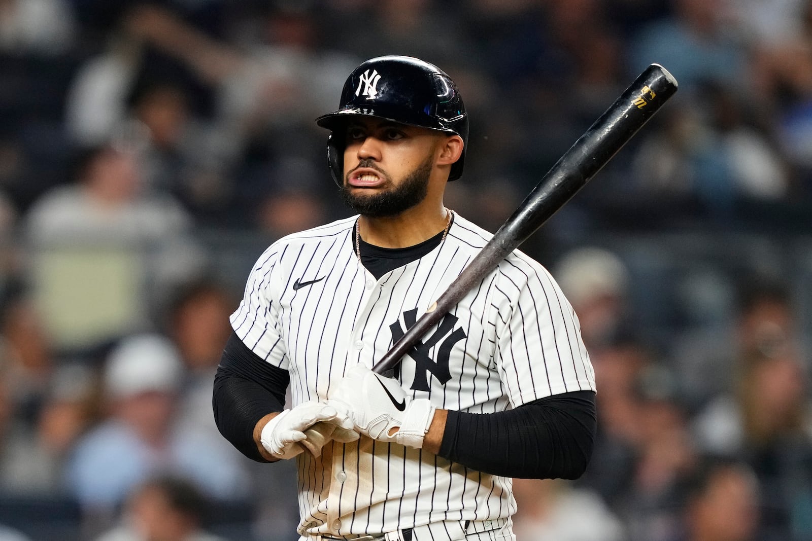 New York Yankees' Jasson Domínguez (24) reacts after striking out during the sixth inning of a baseball game against the Seattle Mariners, Thursday, July 10, 2025, in New York. (AP Photo/Yuki Iwamura)