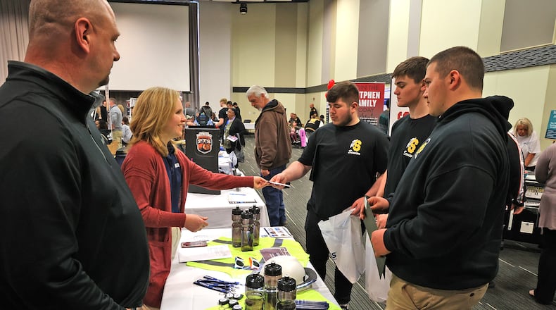 Chad Campbell and Becca McGillis, from Marker, talks with a group of seniors from Shawnee High School Thursday, April 21, 2022 during the annual Clark County Job Fair in the Hollenbeck-Bayley Conference Center