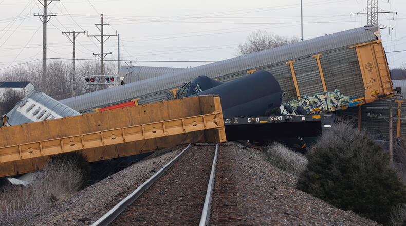 Multiple cars of a Norfolk Southern train lie toppled after derailing at a train crossing with Ohio 41 in Clark County, Ohio, Saturday, March 4, 2023. (Bill Lackey/Springfield-News Sun via AP)