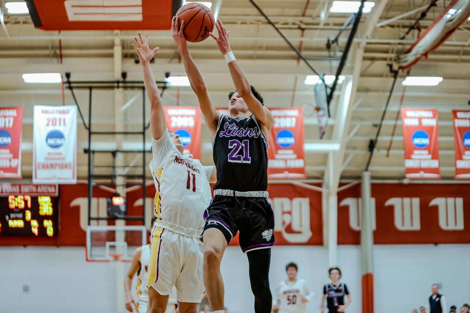 Emmanuel Christian Academy junior Josh Witherow drives to the basket while Northeastern's Rhett Lough attempts to block his short during their game on Dec. 30, 2025, at Wittenberg University's Pam Evans Smith Arena. MICHAEL COOPER / STAFF