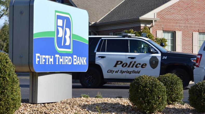 A suspect who robbed a a Fifth Third Bank location in Springfield Monday had his face covered with two scarfs, a police report says.