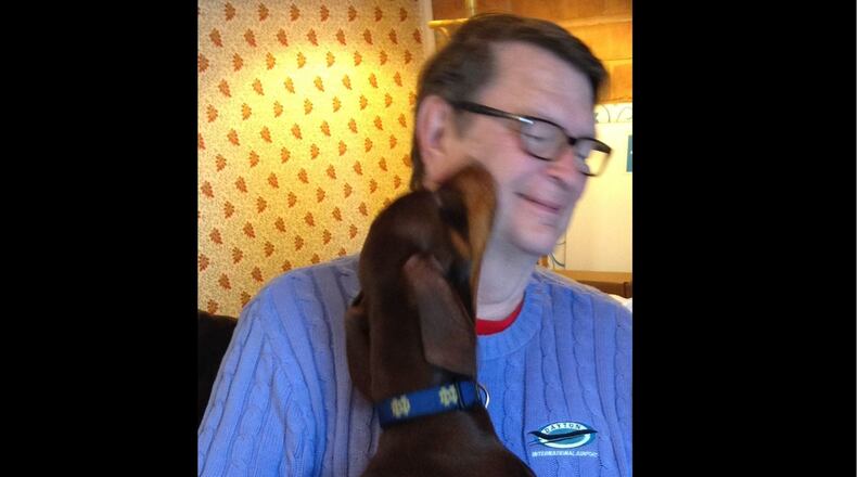 Local attorney and writer Merle Wilberding with his dog Gripper in January of 2019.