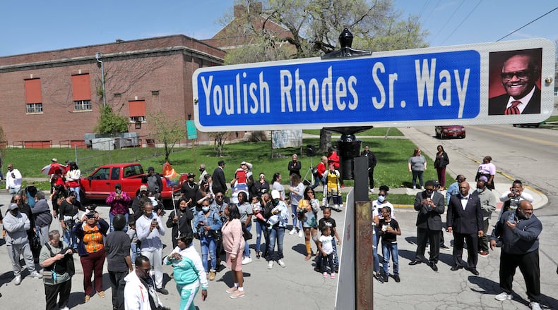 Dozens gathered for the unveiling of a Springfield street sign that shares the name and image of a beloved former resident.