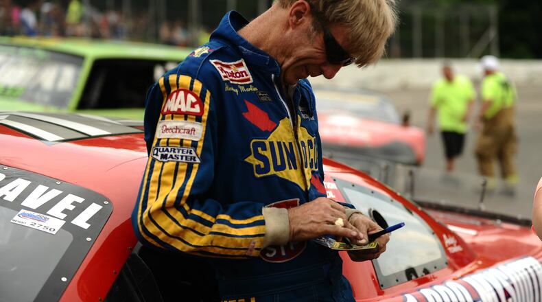 Two-time Daytona 500 champion Sterling Marlin signs autographs for fans during a pre-race meet and greet at Shady Bowl Speedway on Saturday. Marlin, from Columbia, Tenn., was involved in a three-car accident early in the feature and finished 19th. Contributed / Greg Billing