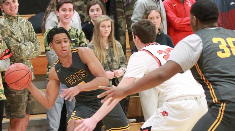 Josh Tolliver of Springfield (with ball) draws Beavercreek defender Braden Grant on Dec. 17, 2019. MARC PENDLETON / FILE