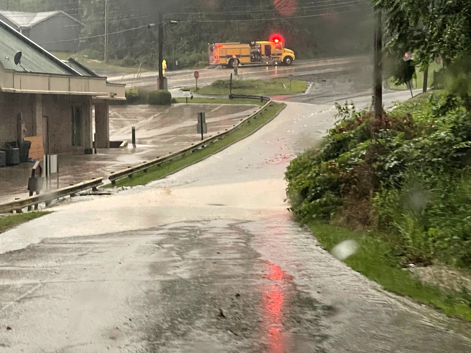 Water, mud and debris cover National Road in Wheeling, W.Va., Thursday, June 26, 2025. (Jennifer Compston-Strough/The Intelligencer via AP)