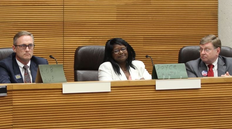 Recently-elected Springfield city commissioners Rob Rue (left), Joyce Chilton and David Estrop takes questions from residents during the Council of Neighborhood Associations’ Candidates Night in September. MICHAEL COOPER/STAFF