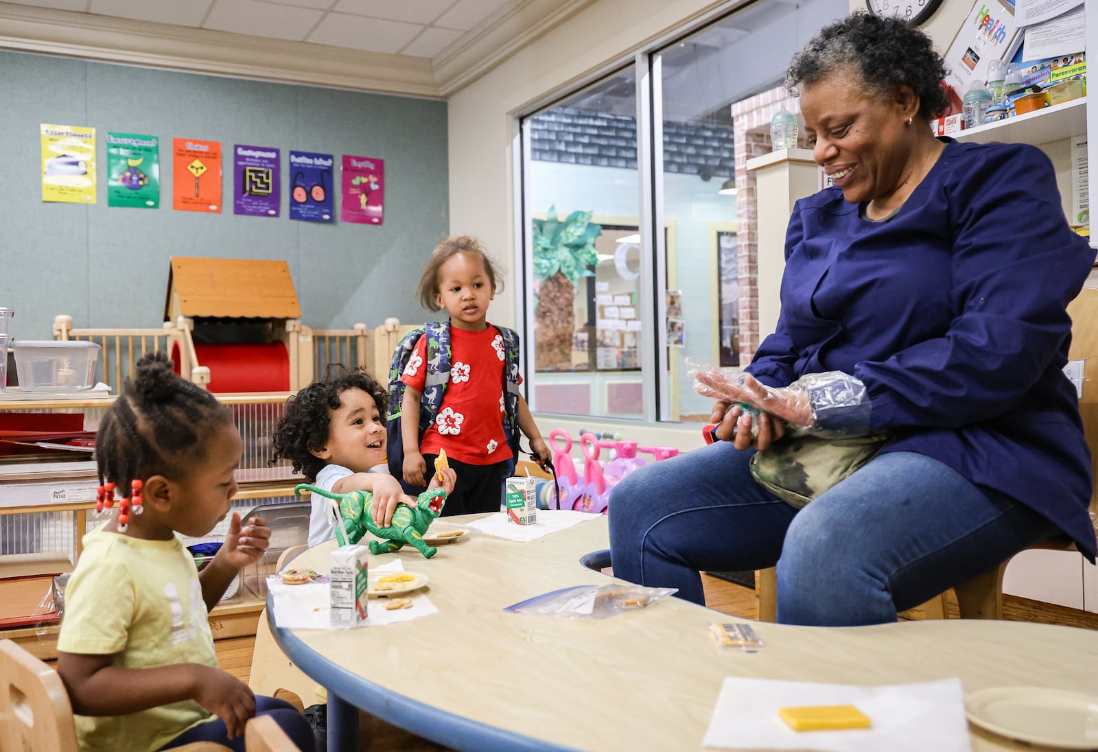 Jamie Vaughn talks to children in her class in Miami Valley Child Development Center in Trotwood on Tuesday. A program that provides child care and early childhood education could see its funding eliminated if a Trump administration budget proposal moves forward. BRYANT BILLING / STAFF