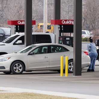 A customer waits as she pumps gas into her sedan at QuikTrip on Edwin C. Moses Boulevard in Dayton on Monday, March 2. Gas prices are expected to increase after military operations began in Iran over the weekend. BRYANT BILLING / STAFF