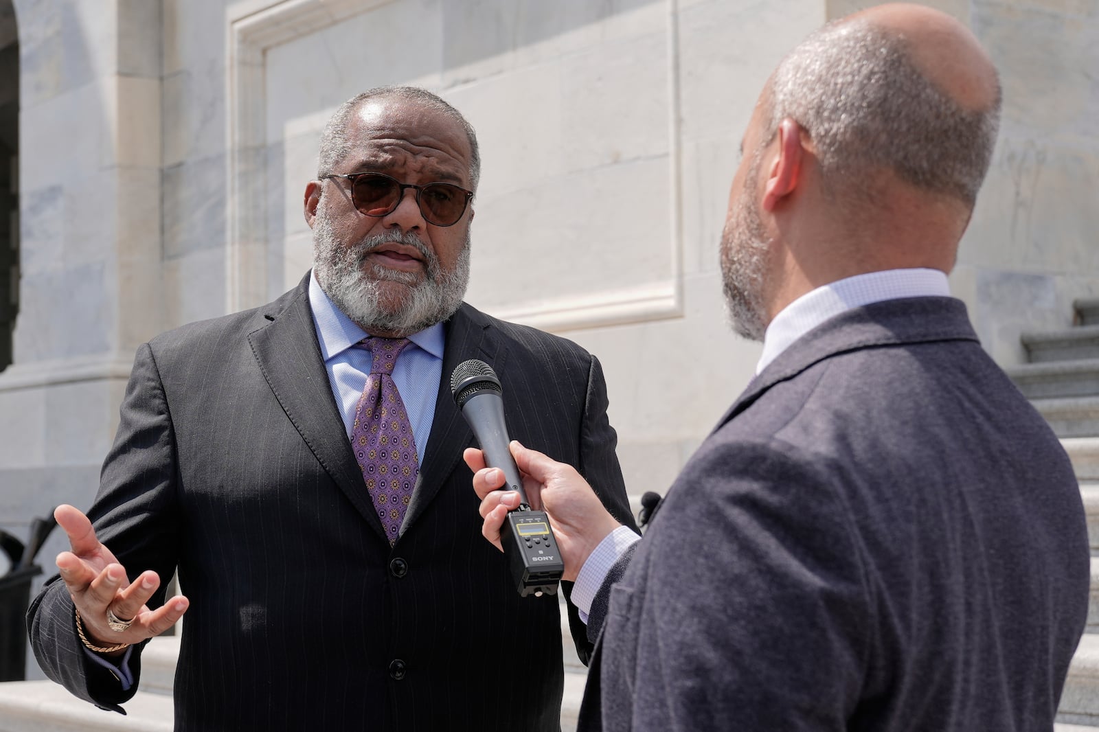Rep. Troy Carter, D-La., left, speaks with reporters outside of the U.S. Capitol, Wednesday, July 2, 2025, in Washington. (AP Photo/Mariam Zuhaib)