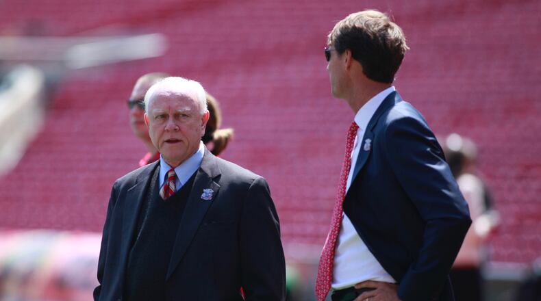 Reds President of Baseball Operations Walt Jocketty, left, and Senior Vice President and General Manager Dick Williams talk on Opening Day in April. David Jablonski/Staff