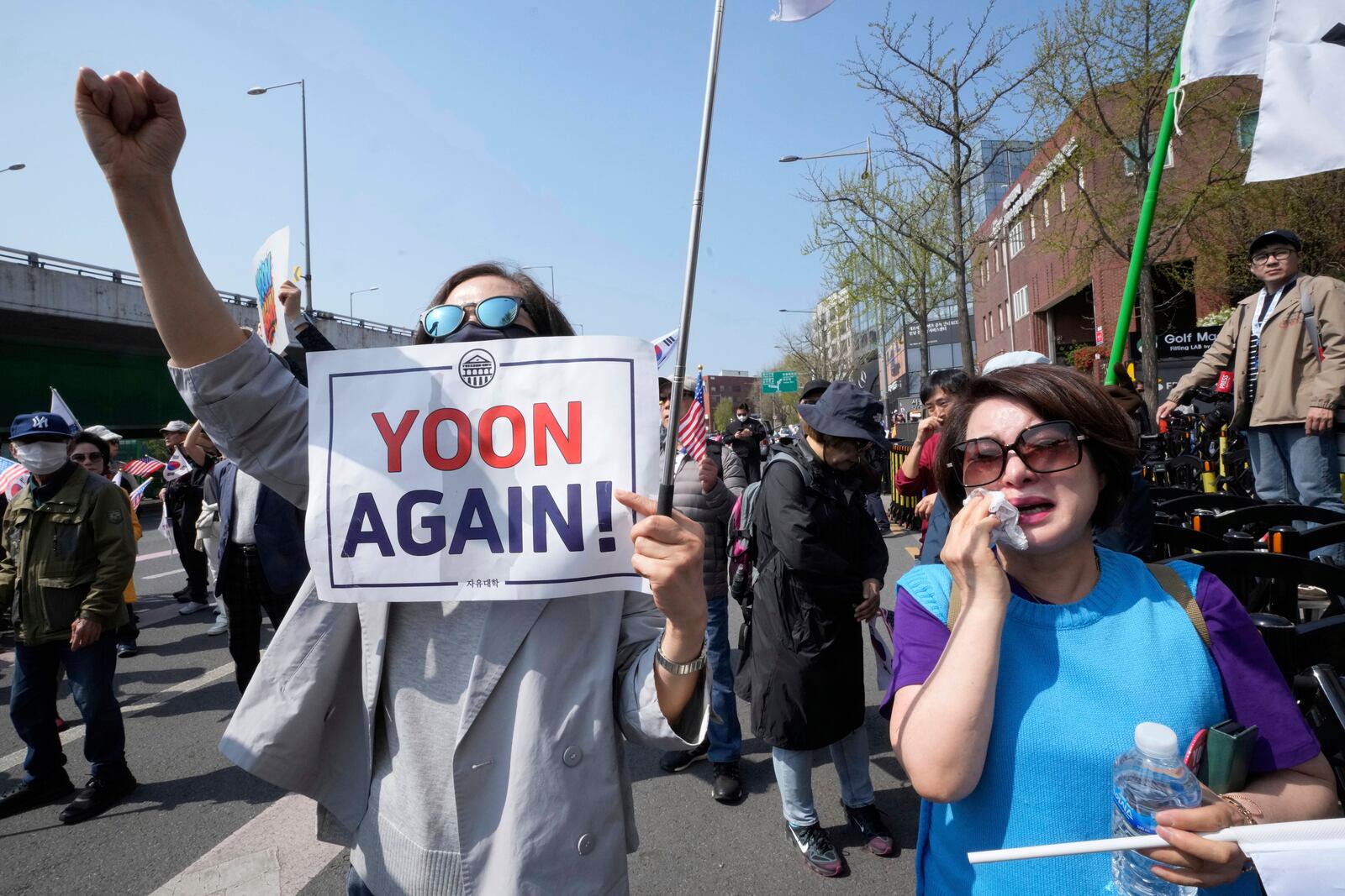 A supporter of recently ousted South Korean President Yoon Suk Yeol weeps during a rally to oppose his impeachment near the the presidential residence in Seoul, South Korea, Friday, April 11, 2025. (AP Photo/Ahn Young-joon)