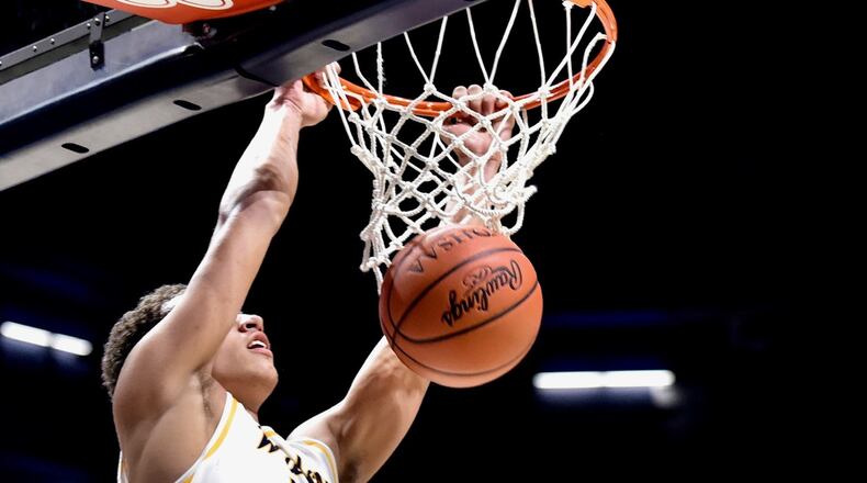 Ray Cole of Springfield slams. Cincinnati Moeller defeated Springfield 67-63 in a boys high school basketball D-I regional semifinal at Xavier University’s Cintas Center on Wednesday, March 13, 2019. NICK GRAHAM / STAFF
