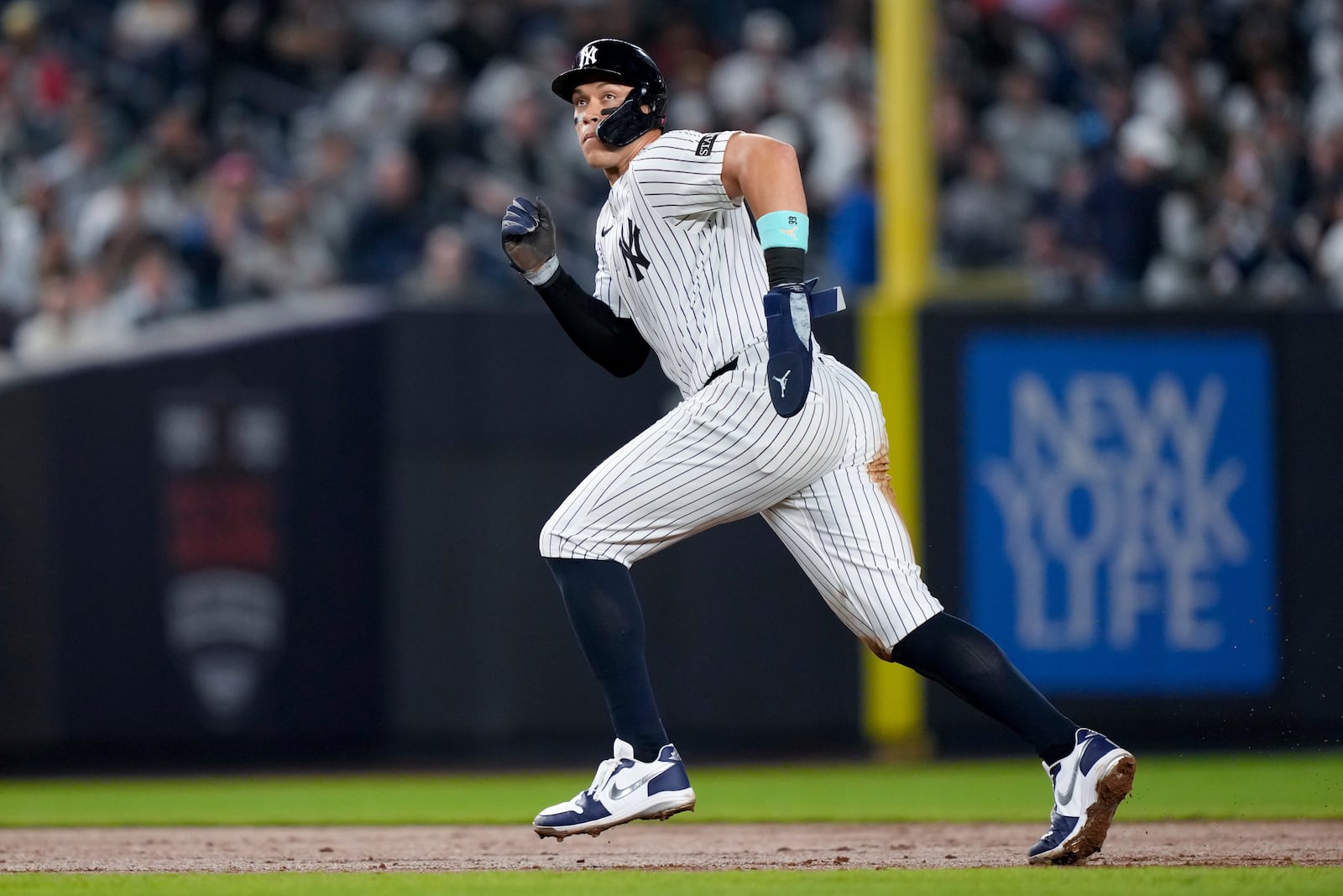 New York Yankees' Aaron Judge scores after Jazz Chisholm Jr. homers on a line drive to right field during the fourth inning of a baseball game against the Arizona Diamondbacks, Thursday, April 3, 2025, in New York. (AP Photo/Julia Demaree Nikhinson)