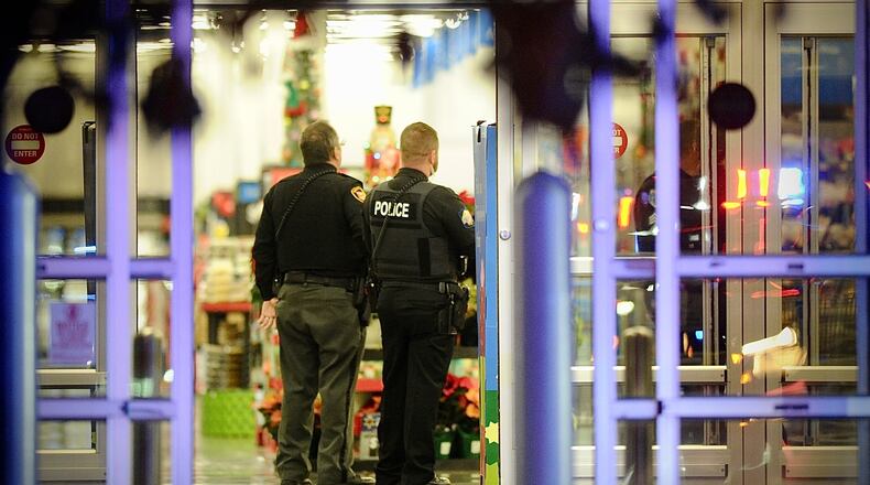 File - Police responded to the scene of a shooting on Monday, Nov. 20, 2023 in Beavercreek. Police say a shooter opened fire at a Walmart, wounding four people before apparently killing himself. The attack took place Nov. 20 at a Walmart in Beavercreek, in the Dayton metropolitan area. (Marshall Gorby/Dayton Daily News via AP)