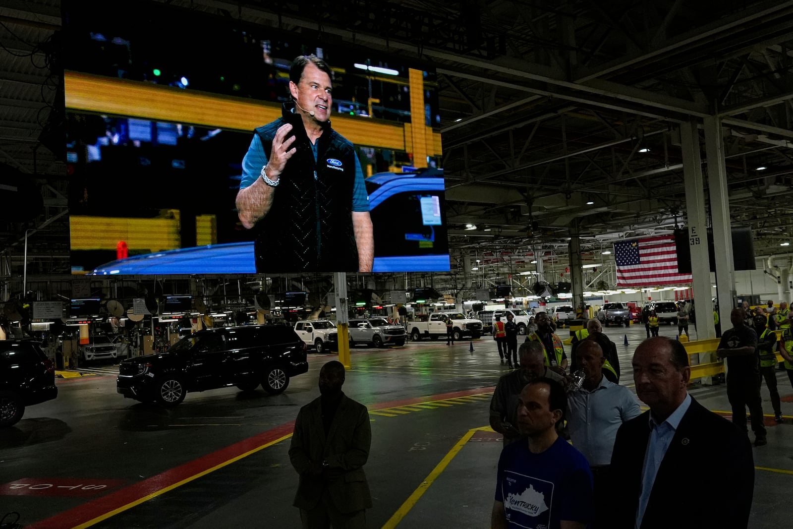 Jim Farley, President and Chief Executive Officer of Ford, is seen on a large monitor as he speaks at the Ford Motor Company Kentucky Truck Plant to launch the 2025 Ford Expedition, Wednesday, April 30, 2025, in Louisville, Ky. (AP Photo/Carolyn Kaster)