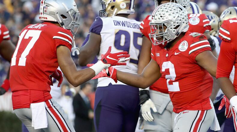 PASADENA, CA - JANUARY 01: Chris Olave #17 of the Ohio State Buckeyes and J.K. Dobbins #2 of the Ohio State Buckeyes celebrate after a touchdown during the second half in the Rose Bowl Game presented by Northwestern Mutual at the Rose Bowl on January 1, 2019 in Pasadena, California. (Photo by Sean M. Haffey/Getty Images)