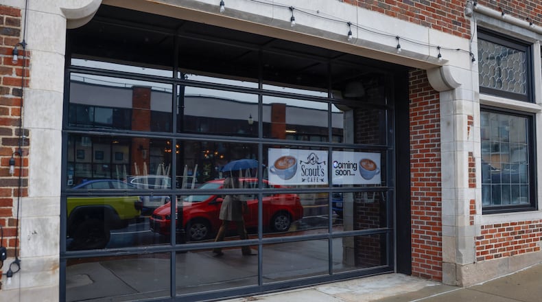 A woman walks outside the upcoming Scout’s Cafe location on Thursday, October 30, 2025. This is the former Winans Coffee location. JOSEPH COOKE/STAFF