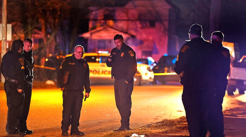 The Springfield Police Division investigates the scene of a shooting along the 600 block of Euclid Avenue Thursday evening, Dec. 21, 2023. According to police they arrived to find a male laying beside the road with a gunshot wound to the head. The victim was transported to Springfield Regional Medical Center and flown by CareFlight to Miami Valley Hospital. BILL LACKEY/STAFF