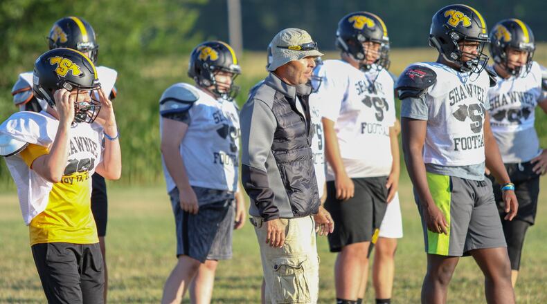 Shawnee High School football coach Rick Meeks leads the team during defensive drills during a preseason practice on Saturday, Aug. 3, 2019. CONTRIBUTED PHOTO BY MICHAEL COOPER