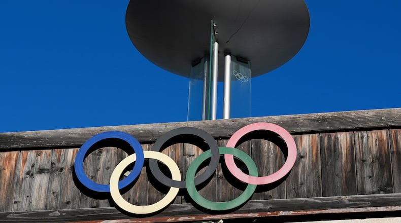 FILE - The Olympic rings adorn the Stadio Olimpico del Ghiaccio, which will be called Cortina Curling Olympic Stadium, venue for the curling discipline at the Milan Cortina 2026 Winter Olympics, in Cortina d'Ampezzo, Italy, Thursday, Jan. 16, 2025. (AP Photo/Giovanni Auletta, File)