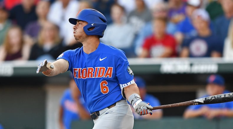 Florida third baseman Jonathan India hits a two run double against the LSU Tigers in the third inning during game one of the College World Series Championship Series on June 26, 2017 at TD Ameritrade Park in Omaha, Nebraska.  (Photo by Peter Aiken/Getty Images)