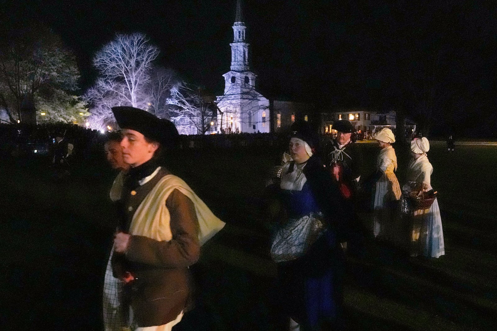 Colonials gather prior to facing the British Regulars during a reenactment celebration of the 250th anniversary of the Battle of Lexington and start of the American Revolution, Saturday, April 19, 2025, in Lexington, Mass. (AP Photo/Charles Krupa)