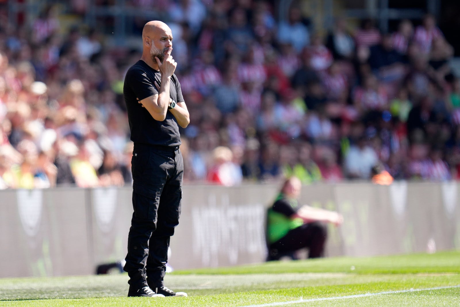 Manchester City manager Pep Guardiola follows the action during a Premier League soccer match between Manchester City and Southampton, at St Mary's Stadium, Southampton, England, Saturday May 10, 2025. (Andrew Matthews/PA via AP)