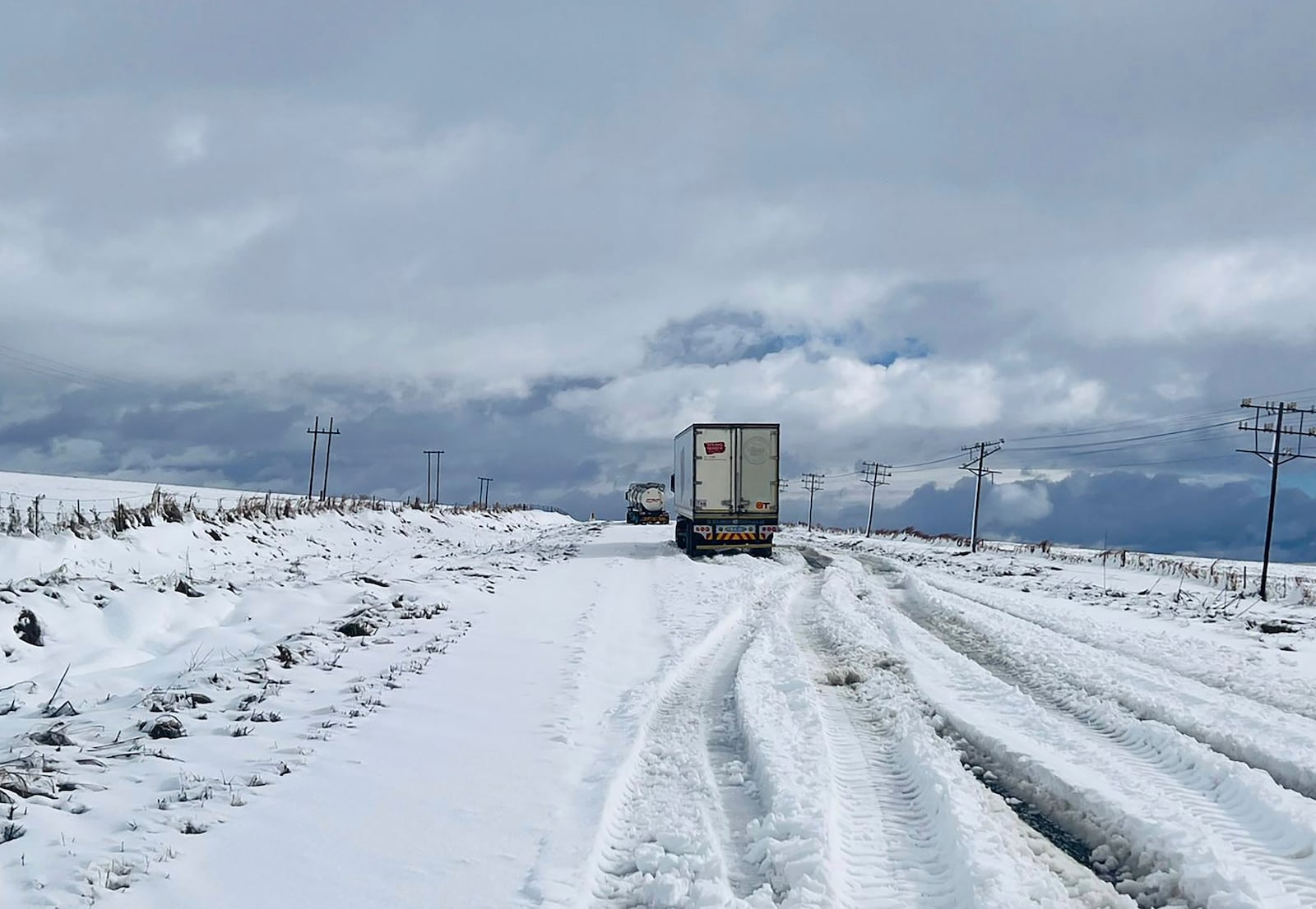 Snow covers the N2 road heading to Nolangeni, South Africa, Tuesday, June 10, 2025. (Greater Kokstad Municipality via AP)