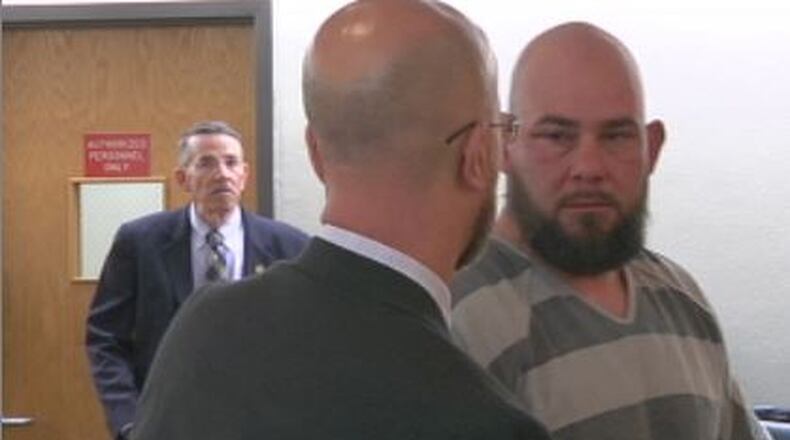 William Abston Jr. speaks with his attorney during his arraignment in Clark County Municipal Court. Abston was charged with multiple felonies related to a domestic violence incident that turned into a standoff. JENNA LAWSON/STAFF.