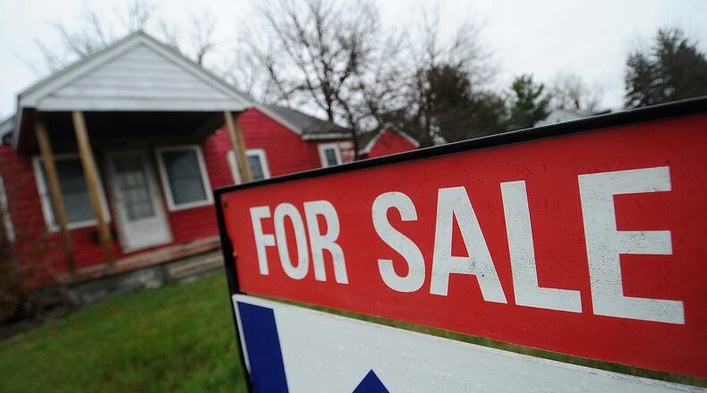 Sales of single-family homes in the Dayton area saw an 10.6% drop in sales in March compared to a year ago. March was the seventh consecutive month of decreases in year-over year sales. Pictured is a home for sale on Woodman Drive in Riverside. MARSHALL GORBY/STAFF