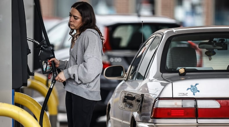 University of Dayton student Cassidy Dyer pumps gas at the UDF on Brown Street Thursday, April 6, 2023. Regular unleaded gasoline is $3.75 a gallon at both Speedway and UDF on the corner of Brown and East Stewart streets in Dayton. JIM NOELKER/STAFF