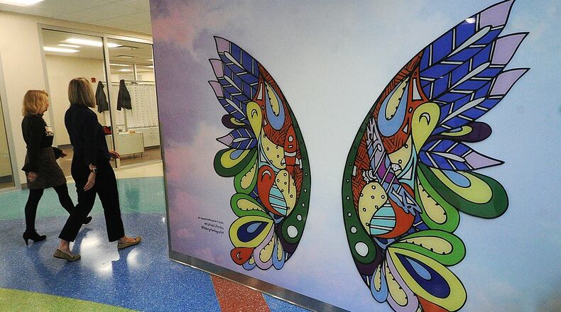 The new five-story 152,000-square-foot specialty care outpatient center at Dayton Children's Hospital started seeing patients in March. As Dayton Children's continues to expand its main campus, the hospital recently announced a partnership for a West Dayton facility that will include a pediatric clinic and a market, the latter being headed up by Sunlight Village. MARSHALL GORBY\STAFF FILE