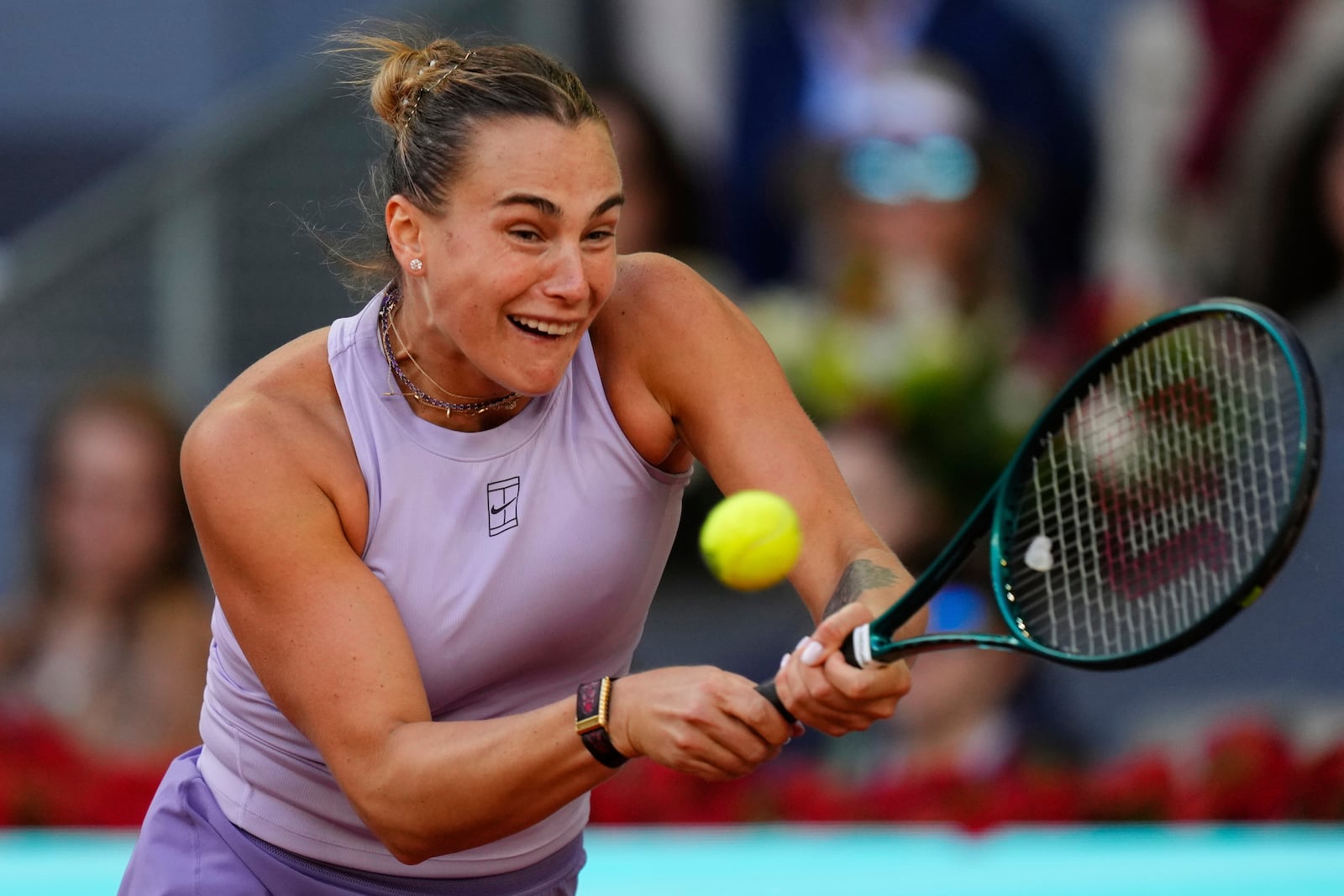 Aryna Sabalenka of Belarus returns to United States' Coco Gauff during the Madrid Open tennis final in Madrid, Spain, Saturday, May 3, 2025. (AP Photo/Jose Breton)