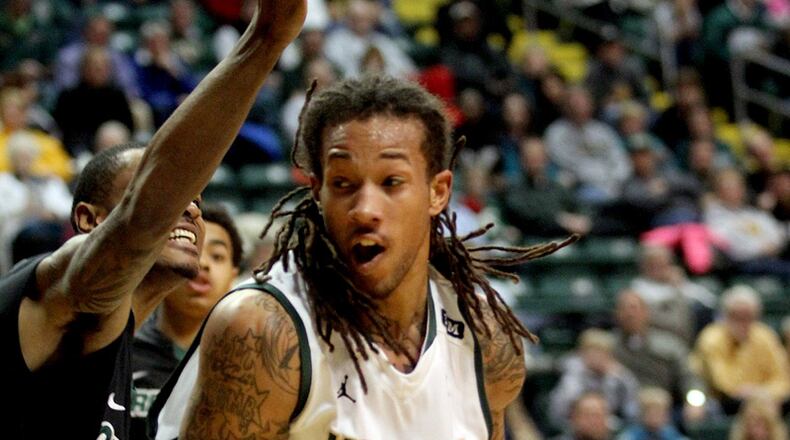 Wright State forward Taveres Sledge moves in to score against Green Bay forward Greg Mays during their game at the Nutter Center in Fairborn Thursday, Jan. 3, 2013.