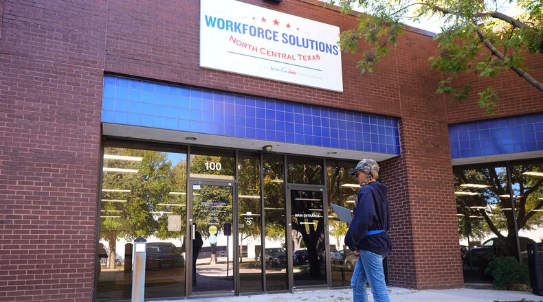 Cela Bratton Williams walks into the Workforce Solutions of North Central Texas office, Thursday, Oct. 30, 2025, in Plano, Texas. (AP Photo/Tony Gutierrez)