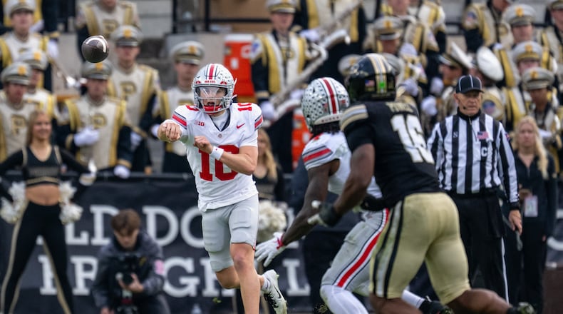 Ohio State quarterback Julian Sayin (10) throws a pass during the second half of an NCAA college football game against Purdue, Saturday, Nov. 8, 2025, in West Lafayette, Ind. (AP Photo/Doug McSchooler)