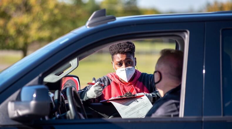 A representative of Silfex participates in a drive-thru job fair that was hosted in Clark County last year as the company looked to fill positions at its locations in Springfield and Eaton. The company will be hosting two similar events this month as it looks to hire over a 100 people. Contributed.